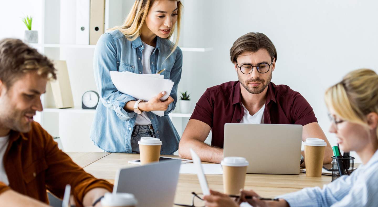 Blurred background with people working in an office